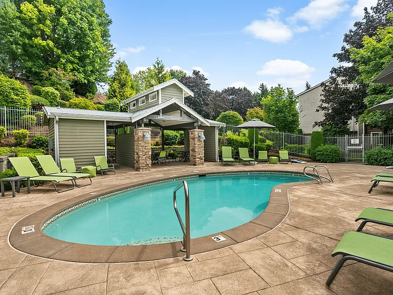 Relax and recharge by the pool with shaded seating and plenty of lounge space.