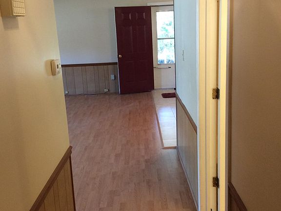from hall looking toward open concept back yard living room an
