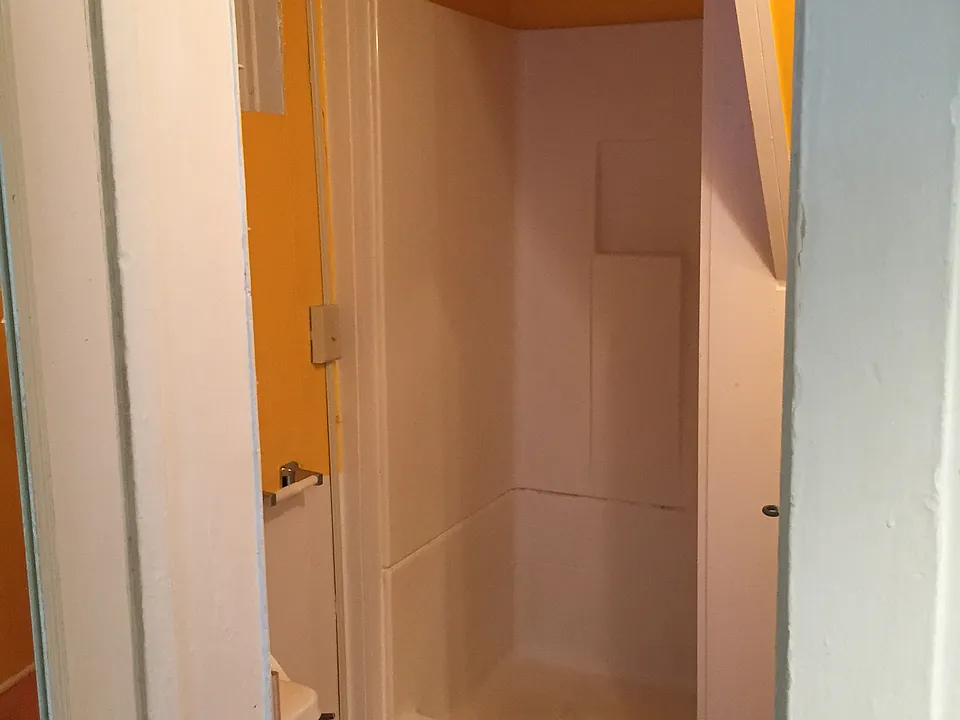 Full Bathroom with shower and updated vanity and mirror.