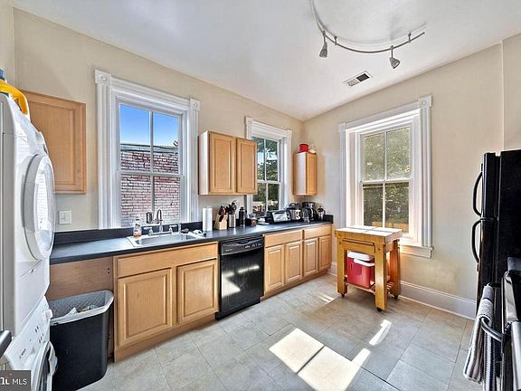 Large, sunny kithen includes in-unit laundry.