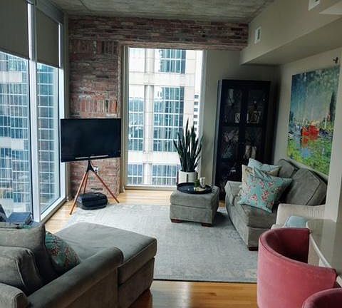 Living area, corner unit with windows facing west and Church street