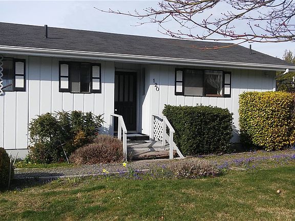 Window on right is 2nd bedroom; middle window is hall bath; window on left is master bath. 
