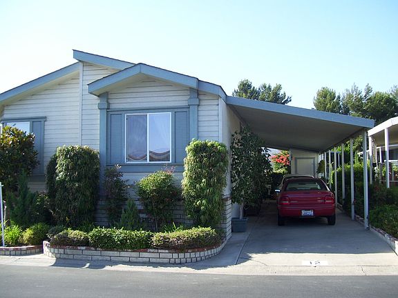 Front View W/ Carport