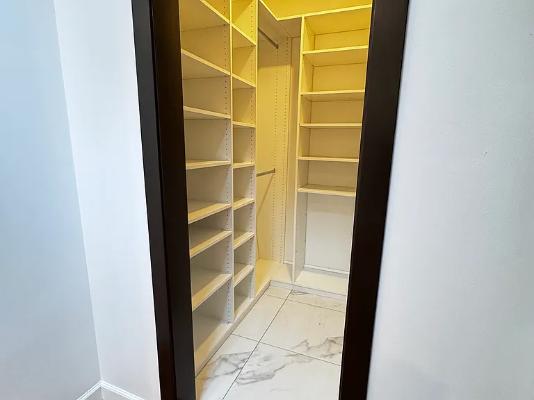 Walk In Closet off Den