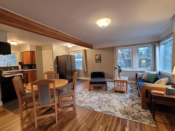 Living room & kitchen - open floor plan, big windows (lots of light)