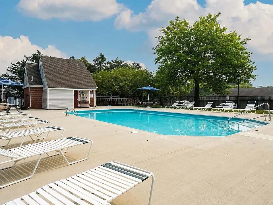 Poolside area with patio furniture