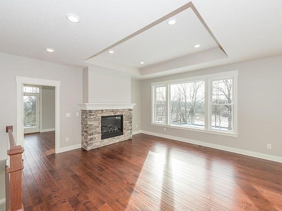 The great room and kitchen provides plenty of room for entertaining guests while looking out to the back yard and wild life.