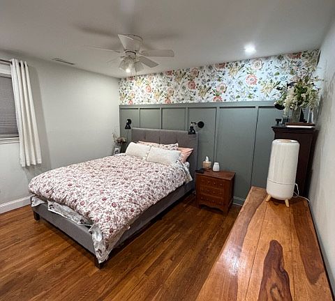 Inset wood paneling detail with vibrant floral accent wall.