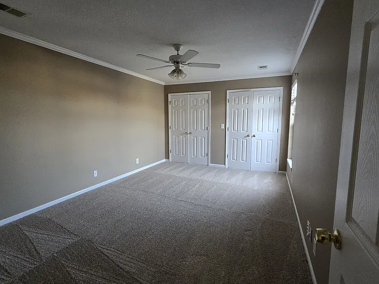 Master bedroom with two closets