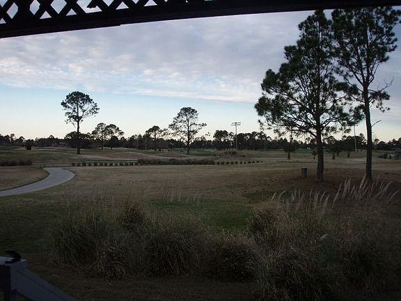view of golf course from living room porch