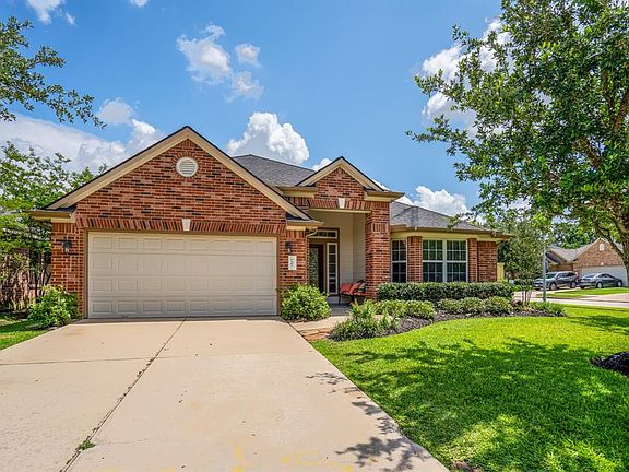 As you walk up to the home, you are greeted by nice landscaping, and an inviting porch.