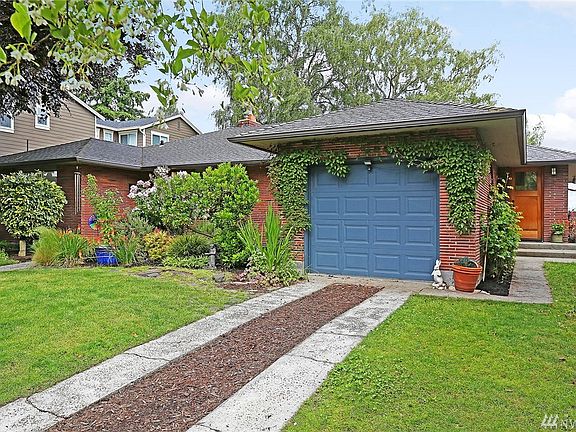 Single car attached garage with extra parking off street.  Side door access.