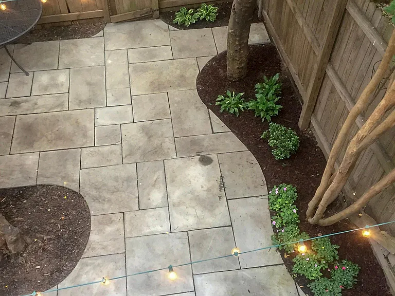 Fenced-in backyard patio perfect for entertaining