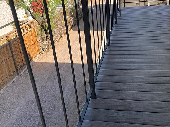 the wrap-around patio provides ample area for outdoor seating, this is the shorter side