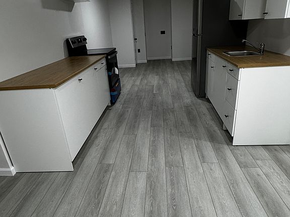 Kitchen with living, office, flex space at the end.