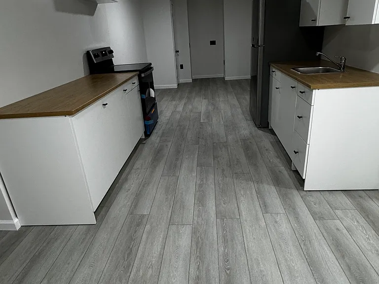 Kitchen with living, office, flex space at the end.
