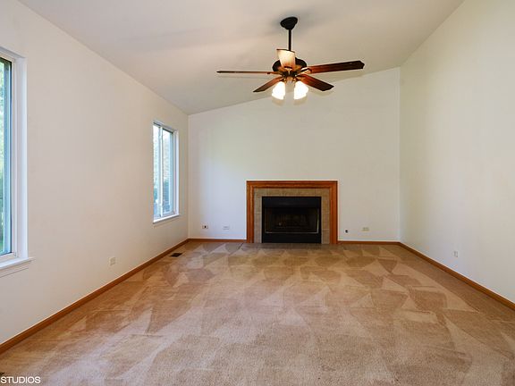 Family Room w/ gas fireplace and vaulted ceiling