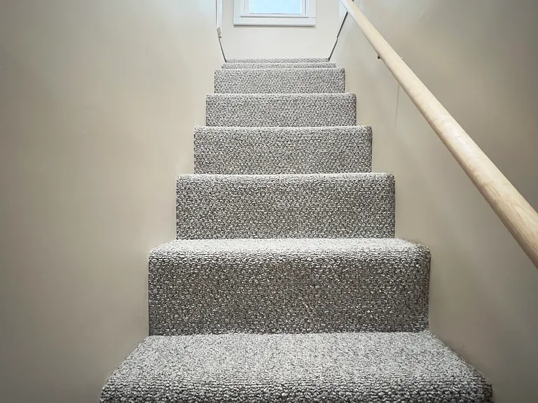 Newly carpeted stairway to 3rd bedroom