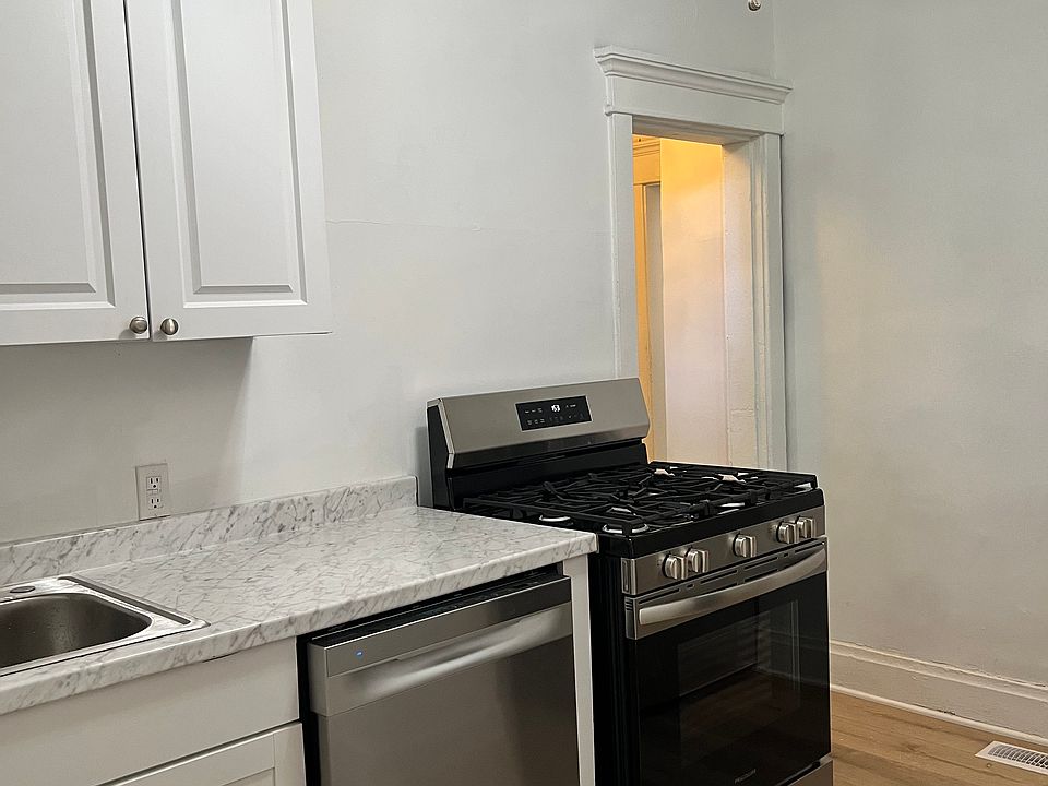 Kitchen - stainless steel gas oven; sleek dishwasher