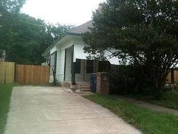 Driveway with gate and fenced yard/parking