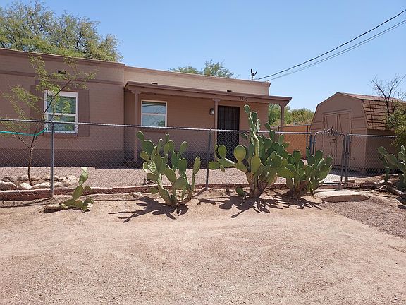 Covered porch Plus large storage shed and private side yard with double gates