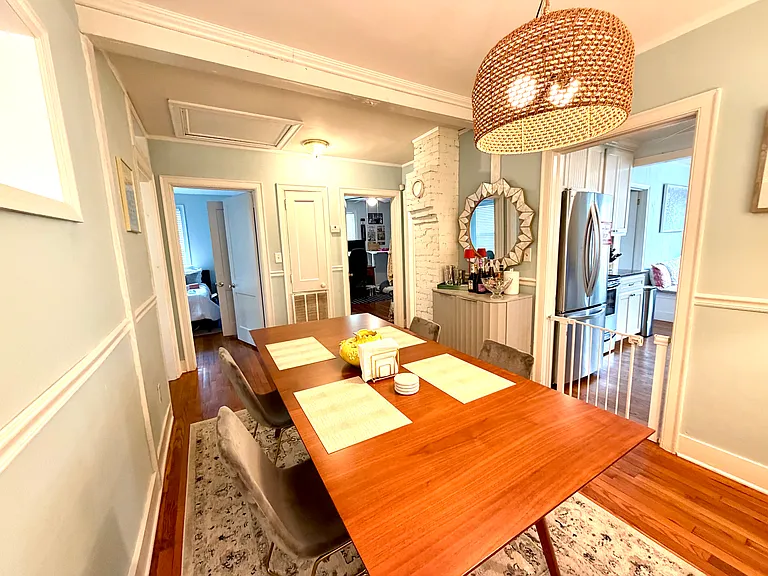dining room facing door on left to front bedroom #1 and middle door to bedroom #1/office