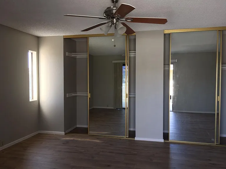 Master bed room with mirrow closet door