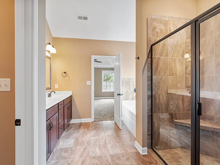 Generously-sized walk-in shower and soaking tub