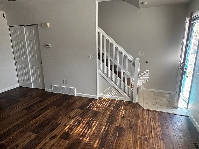 Living room, stairs and front door