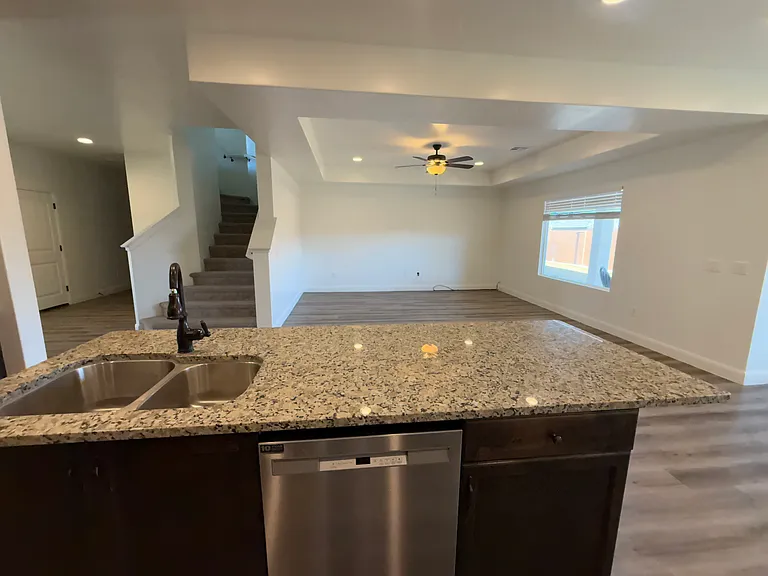 Great room without furniture. (Thiis not the actual home but a photo from a similar home with same floor plan)