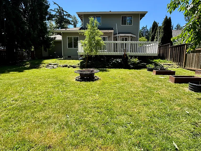 Large Fenced Backyard w/ Fire Pit & Raised Garden Beds