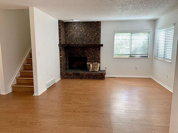 Large Living Room with New Plank Flooring, Paint and Electric Fireplace