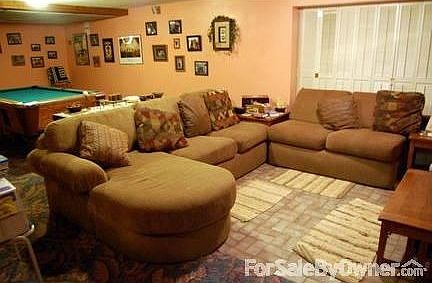 Den in basement
						:
						pool table in back, minibar on side and office and workshop behind louvered door