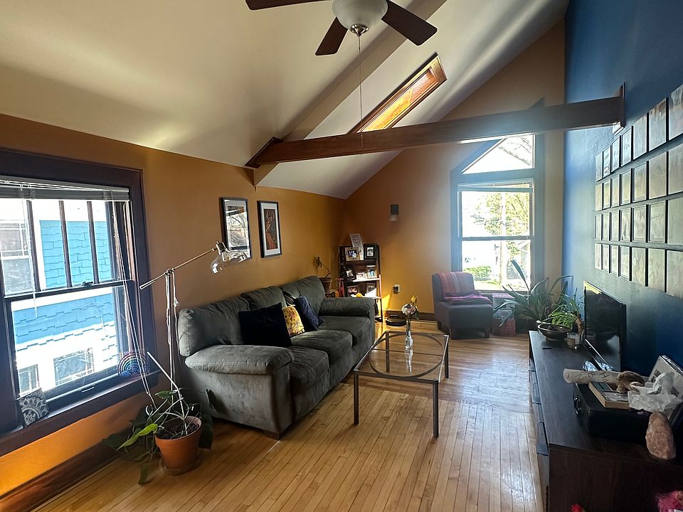 View of living room from upstairs entryway.