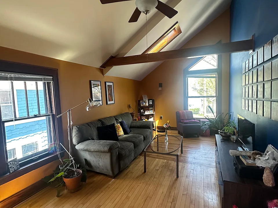 View of living room from upstairs entryway.