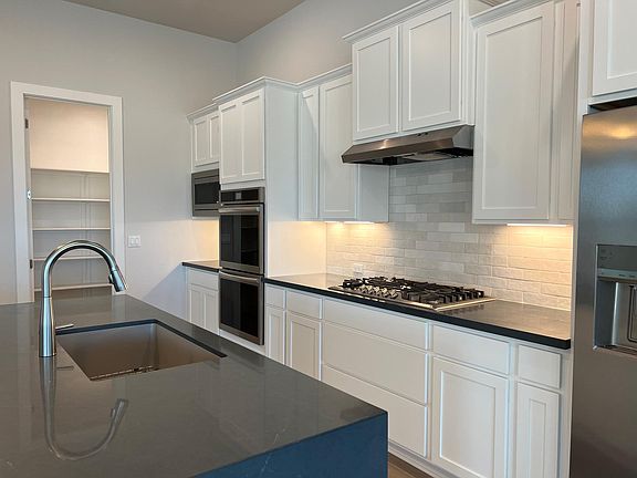 Lots of cabinets and big pantry.