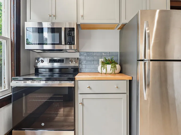 BUILT IN STOVE MICROWAVE and notice the matching fridge. Look at the storage. Color scheme to love...