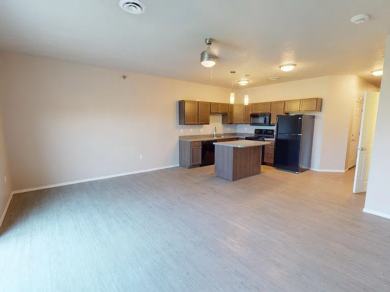 The Highland Townhome features a large open-concept living space with access to a private patio. The Highland Townhome features a large open-concept living space with access to a private patio.