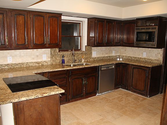 Kitchen has view of backyard