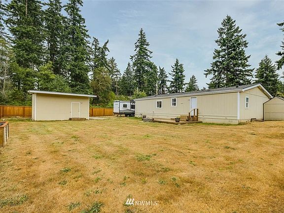 Back yard has room to plant, play, or park the RV