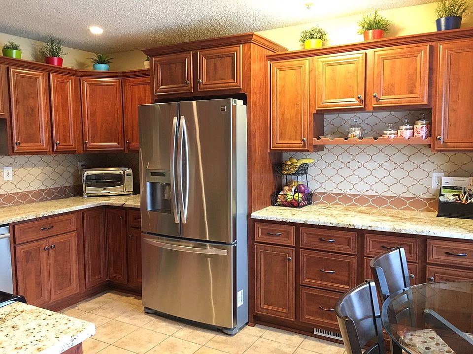 Updated kitchen with SS appliances, high end granite counter
