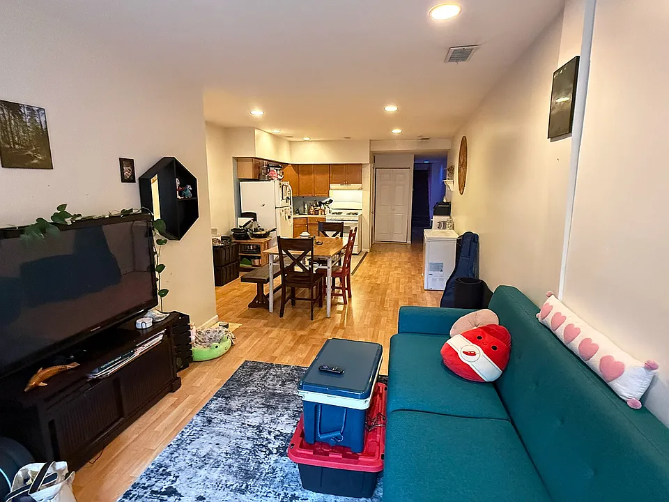 View from the entrance: Living-room flowing into Dining room and Kitchen.