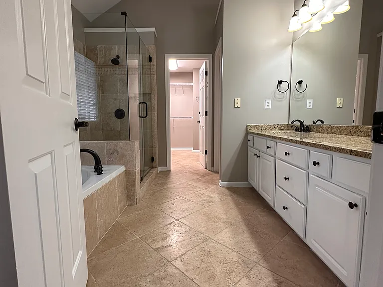 Welcome to your spacious Master Bath and Walk In Closet. Walk In Shower, Garden Tub and Private Bathroom.