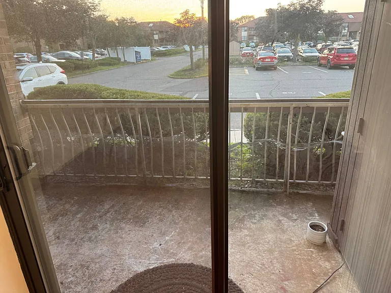 patio view to outside and parking spot next to patio