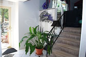 Brightly lit interior & steps to living room level