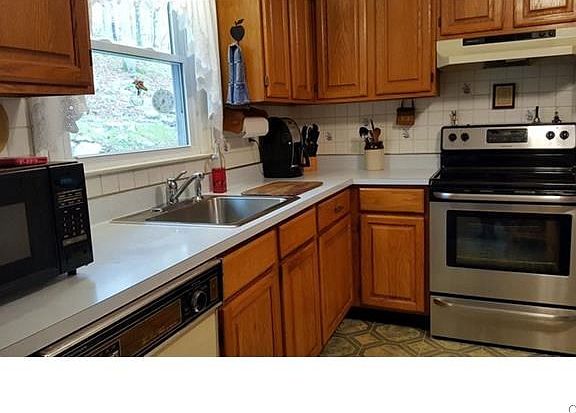Kitchen with great views of the private back yard. Newer stove!