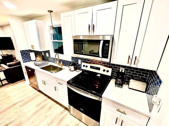 New Refrigerator w/ ice maker, Microwave, Dishwasher, FULL Range, toaster, rice maker, coffee maker, dishes, glasses, utensils, pots, pans, cooking knives.