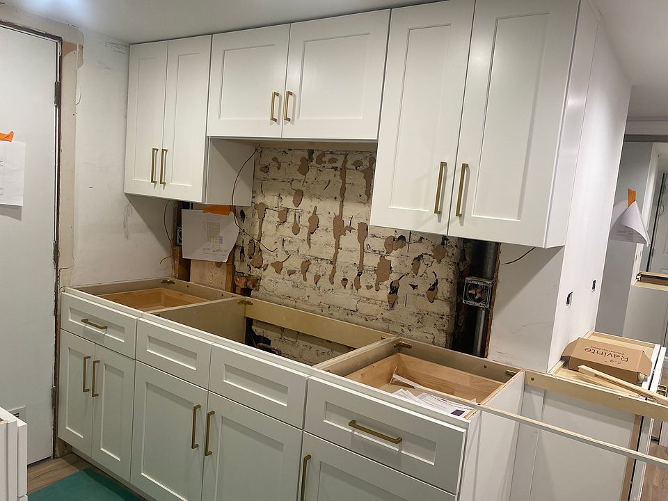 Under construction; new cabinets w brass pulls installed 4/29, quartz countertops and pale blue designer porcelain backsplash next week; stainless steel appliances installed May 9