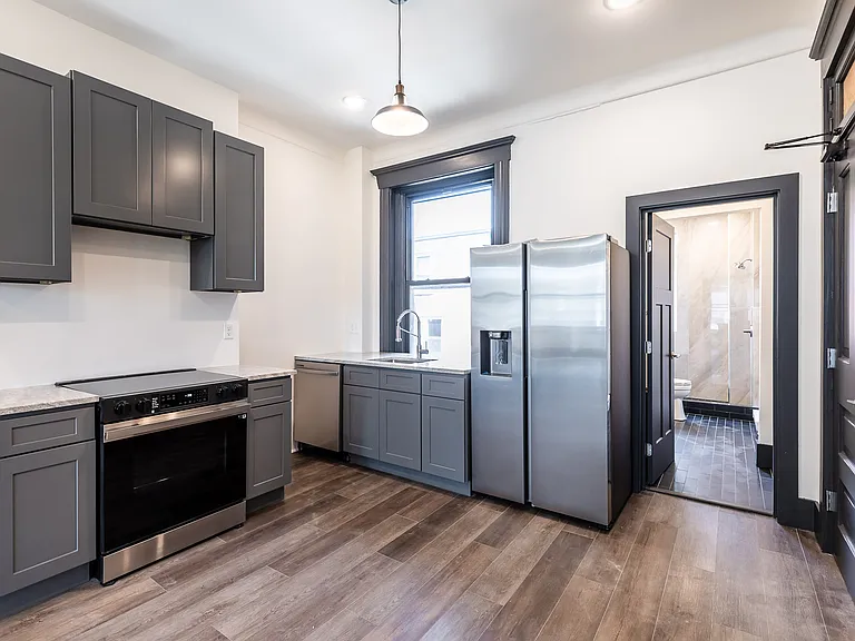 Nice kitchen with factory painted cabinetry, all new appliances with water & ice in fridge, garbage disposal, looks out to courtyard. Top floor with lots of light.
New microwave was installed over range and handles on cabinets.