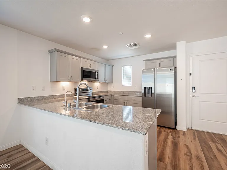 Kitchen - Granite countertops and storage cabinets.